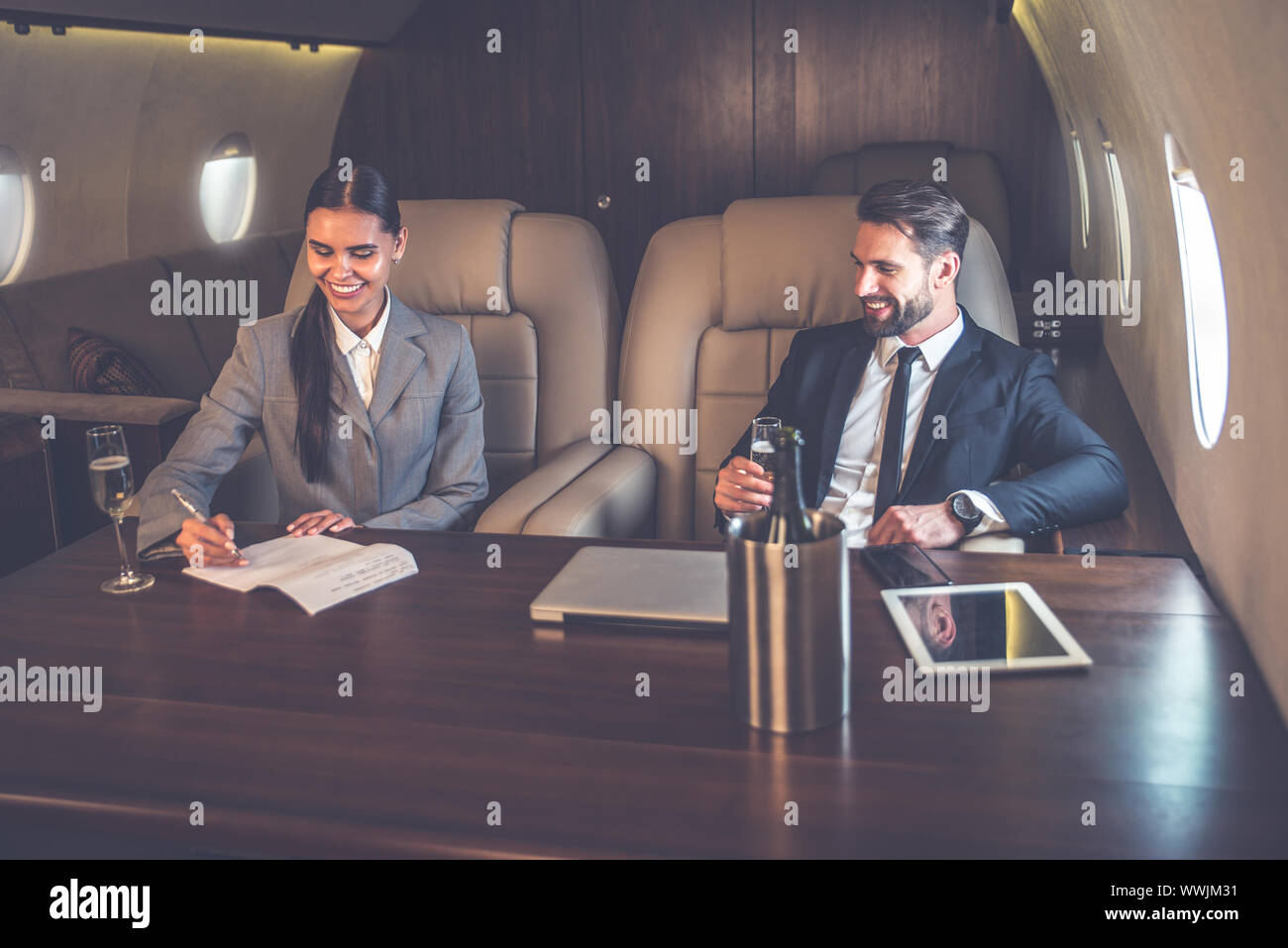 Business team on the private jet Stock Photo Alamy