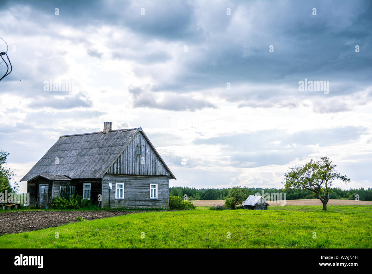 Village house in farm, cloudy day summer Stock Photo - Alamy