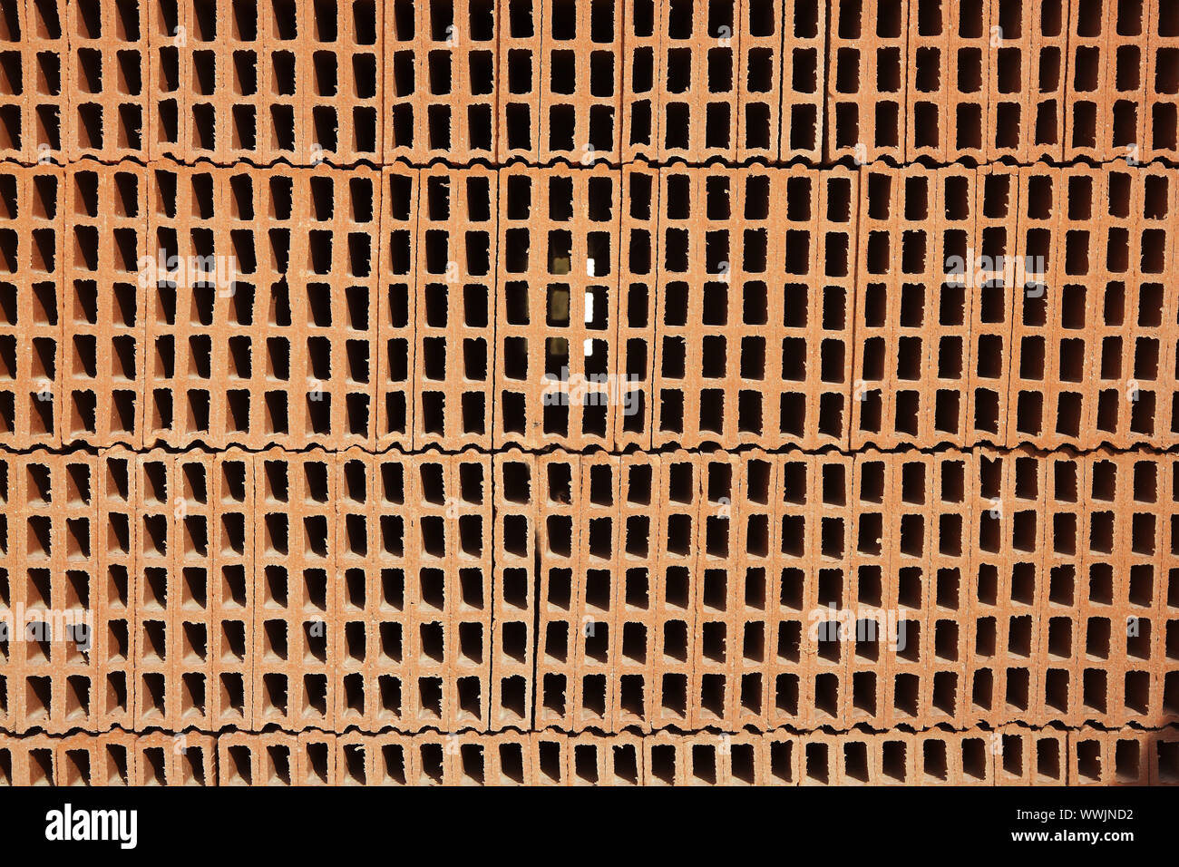 construction bricks stacked red clay brick Stock Photo
