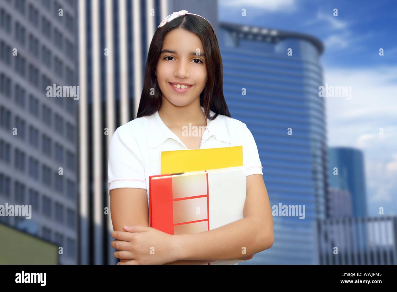 Brunette student young girl teen latin holding books modern city ...