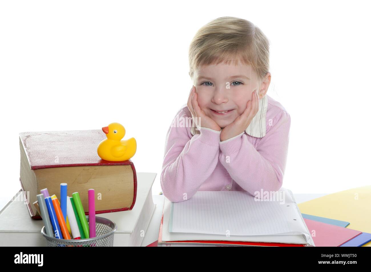 blond little student girl posing and smiling on school desk Stock Photo ...