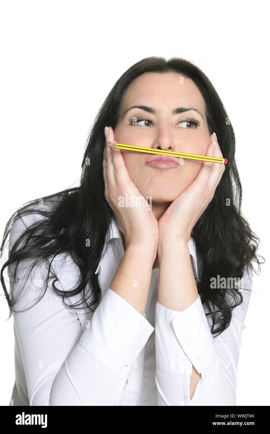 Brunette woman thinking with pencil isolated on white Stock Photo - Alamy