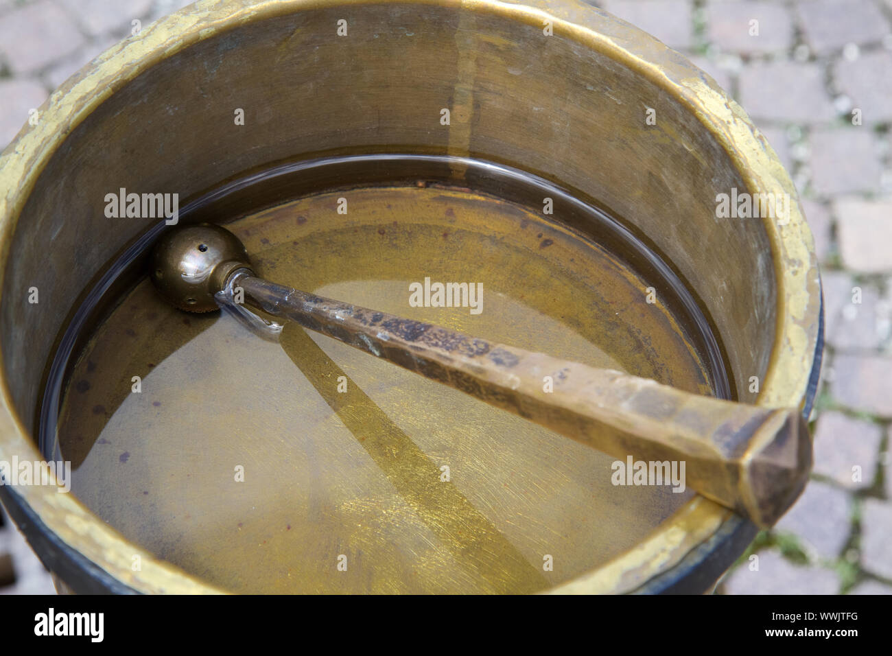 Brass bowl with holy water Stock Photo Alamy