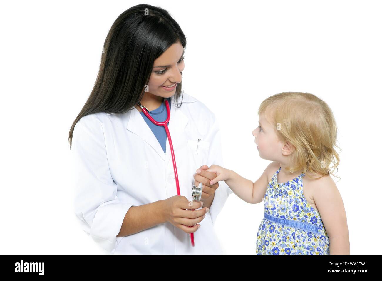 brunette-pediatric-doctor-with-blond-little-girl-on-medical-exam-stock