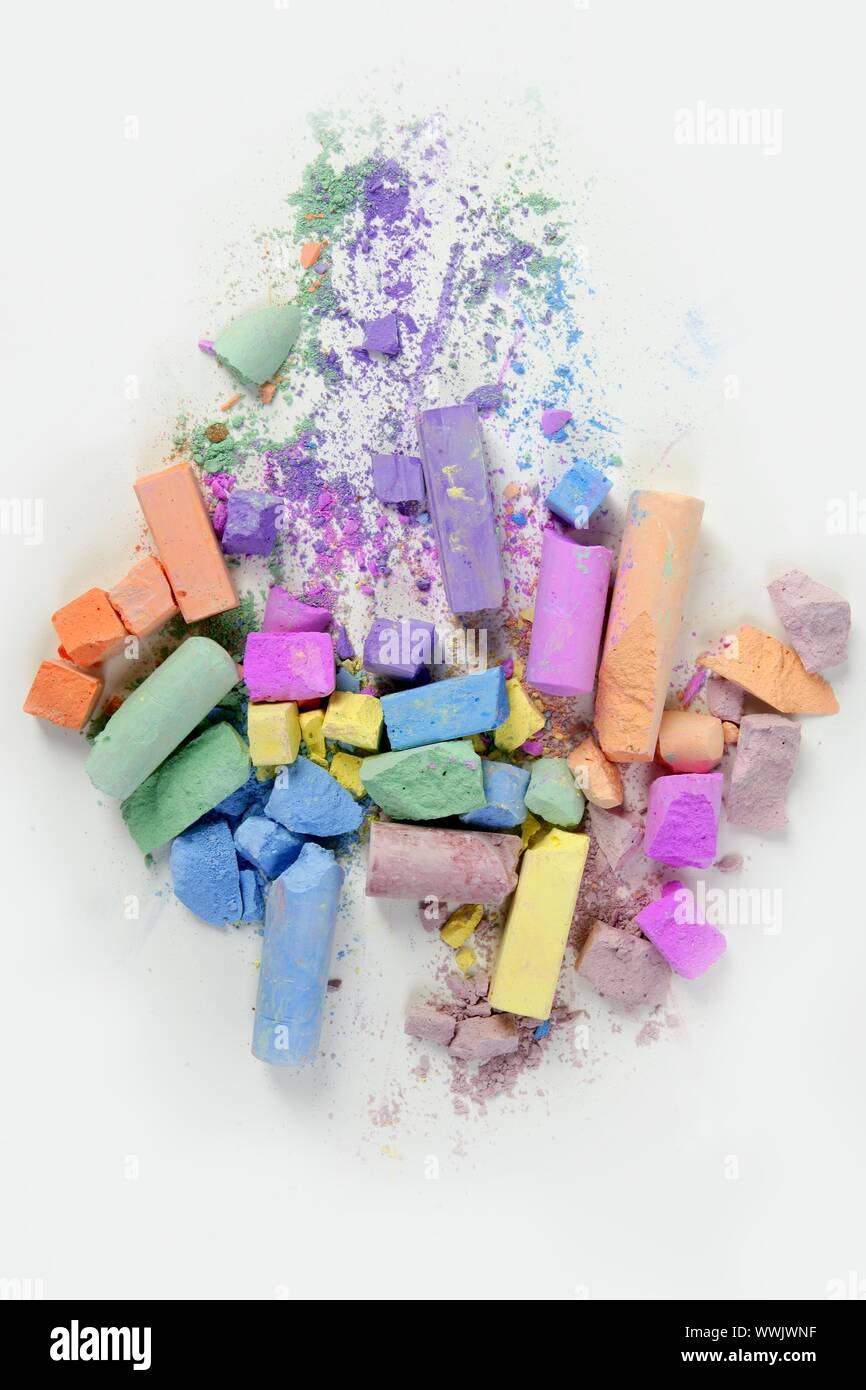 Broken Color Example Colorful chalk broken colors mess over white background Stock Photo - Alamy