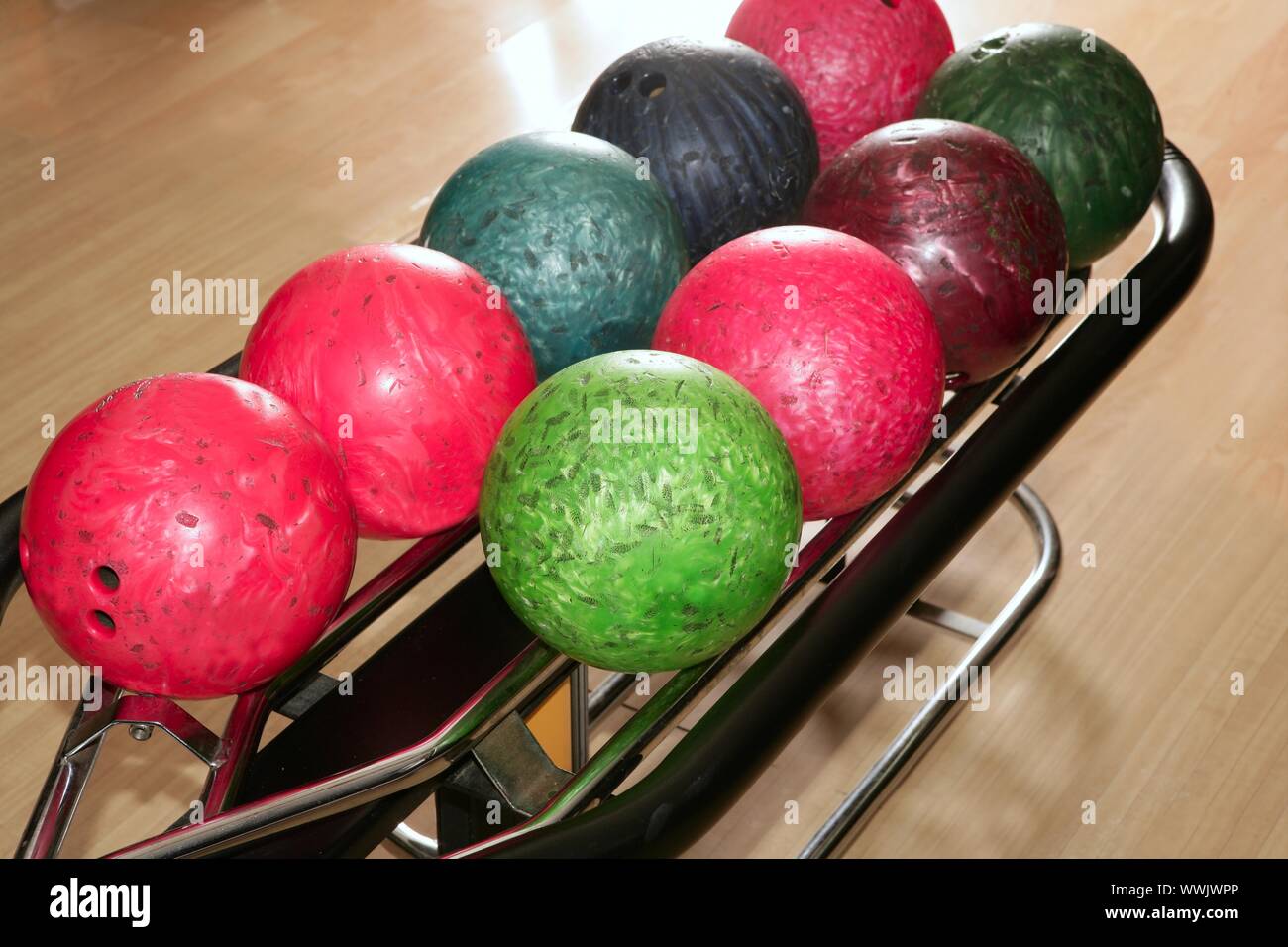 Bowling balls red green closeup row detail Stock Photo - Alamy
