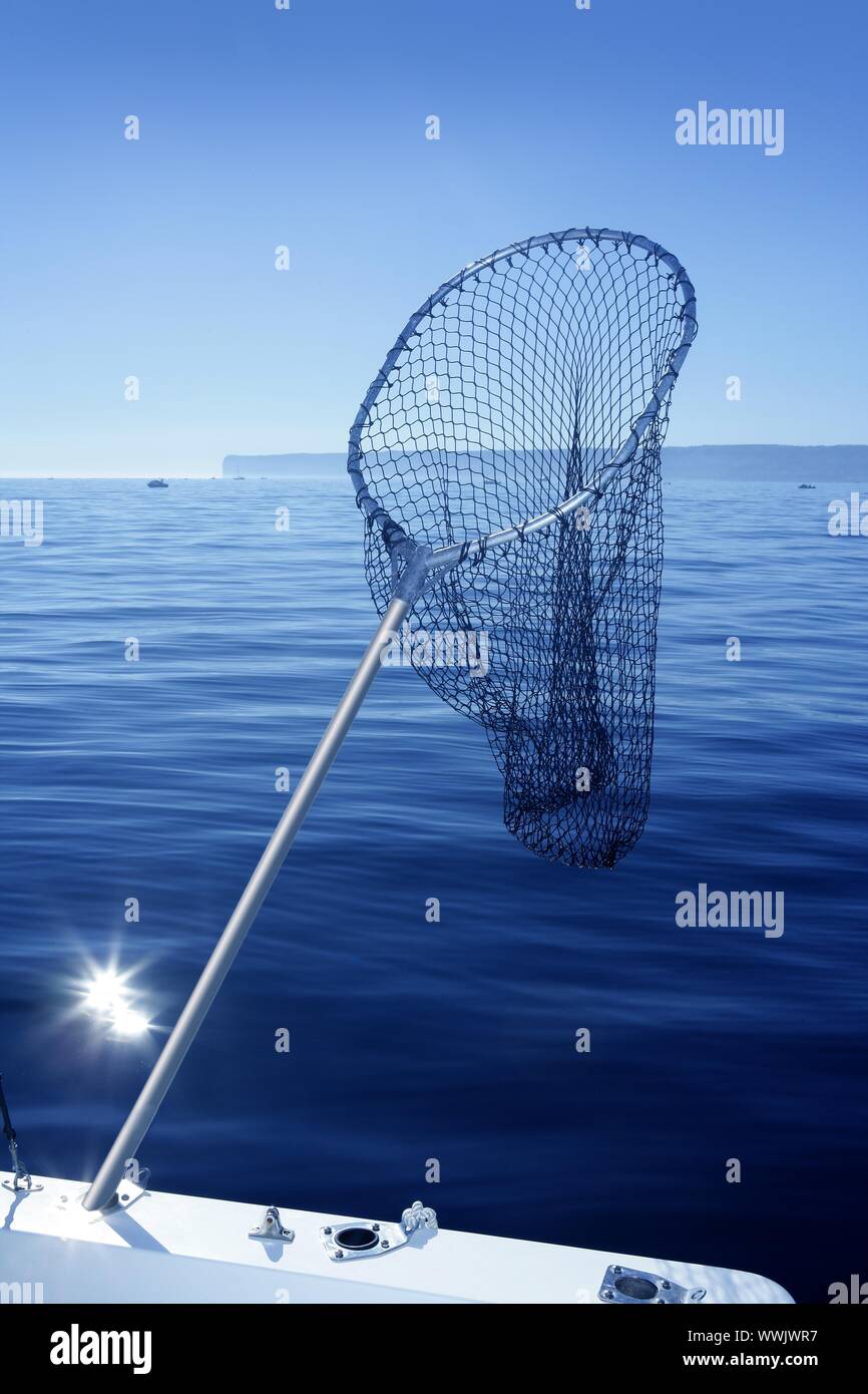Fishing scoop net on boat with blue sea ocean background Stock Photo