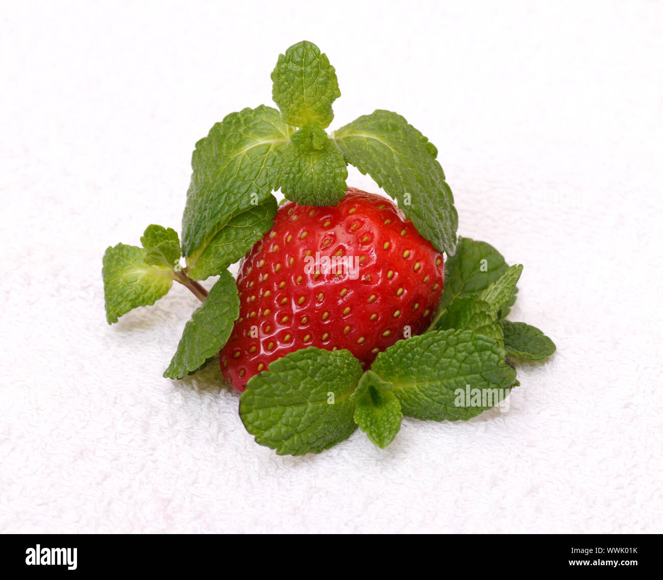 Strawberries with mint over white background Stock Photo - Alamy