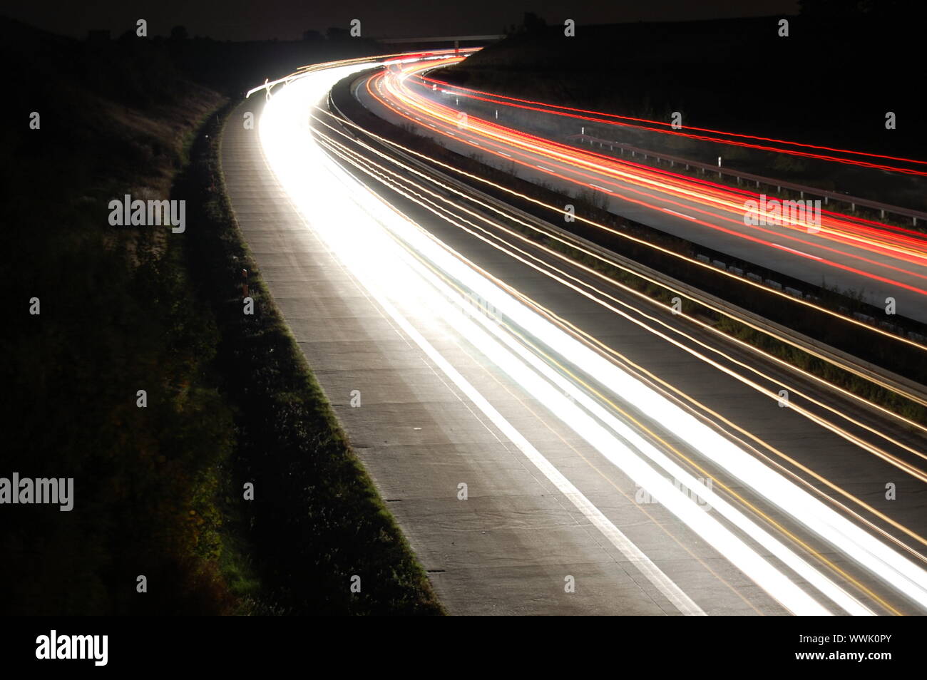 highway at night with car traffic and lights Stock Photo