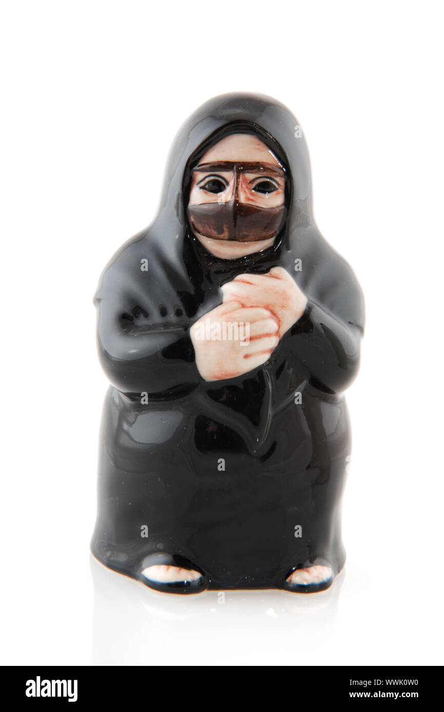 Muslim woman in black burqa isolated over white Stock Photo