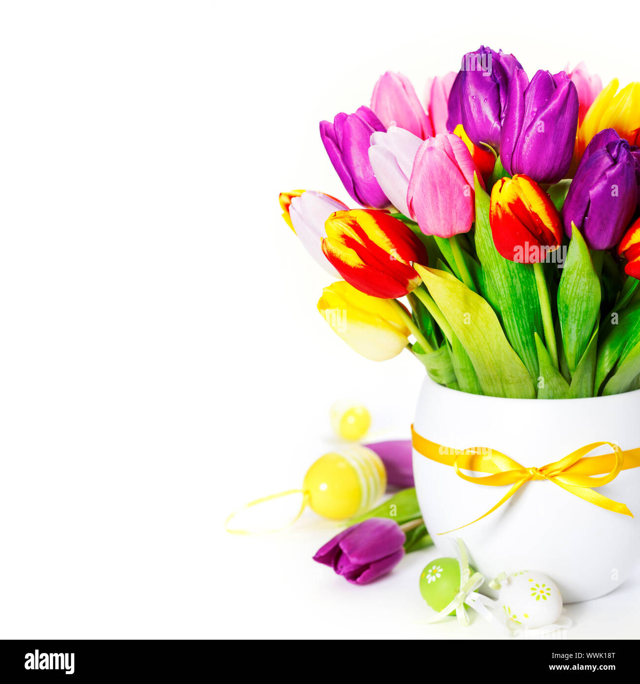 spring tulips with easter eggs on white background Stock Photo - Alamy