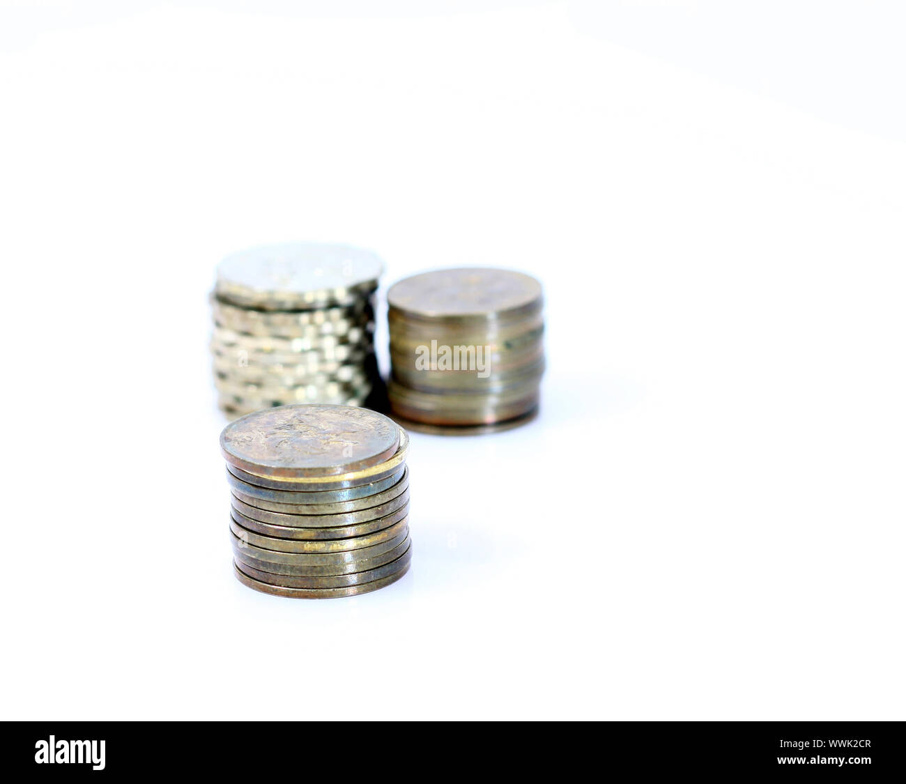 Stack of coins isolated on white background Stock Photo - Alamy