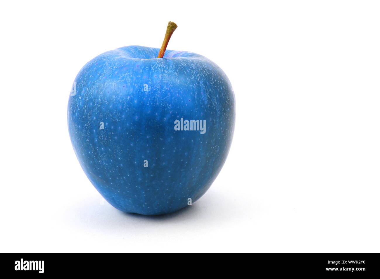 a blue apple fruit isolated on white background Stock Photo - Alamy