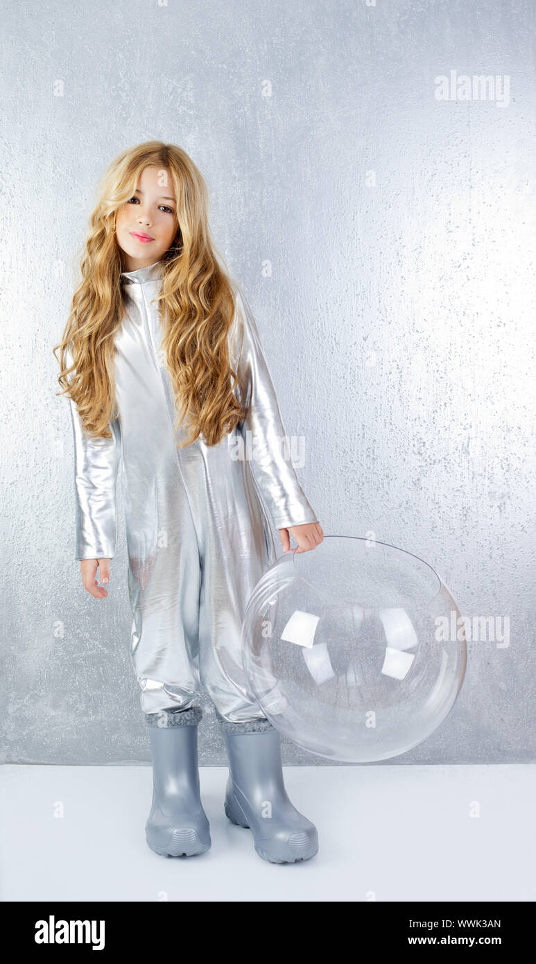 Astronaut futuristic kid girl with silver full length uniform and glass