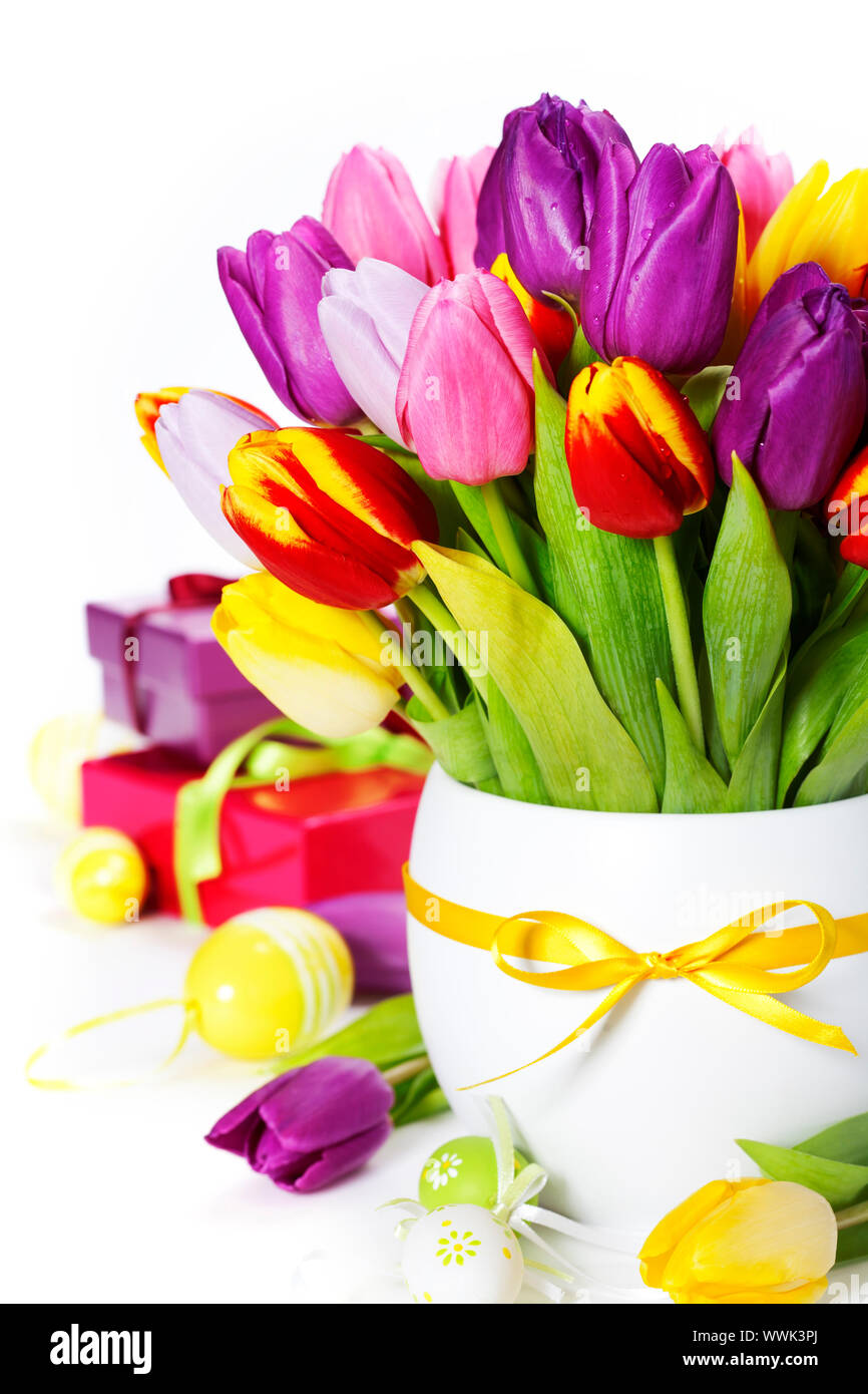 spring tulips with easter eggs and gift boxes on white background Stock ...
