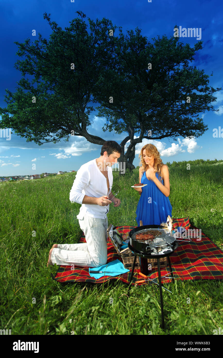 man and woman on picnic in green grass Stock Photo - Alamy