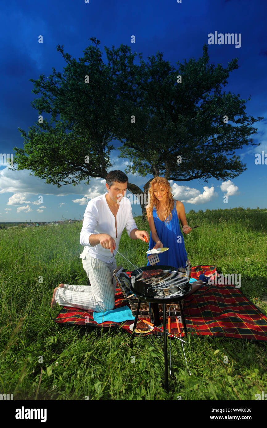man and woman on picnic in green grass Stock Photo - Alamy