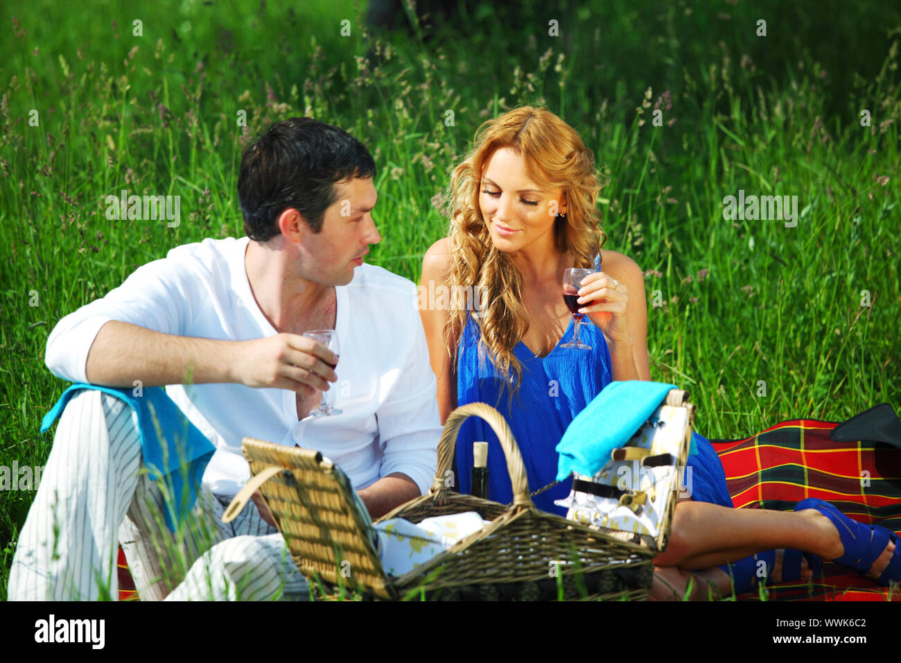 man and woman on picnic in green grass Stock Photo - Alamy