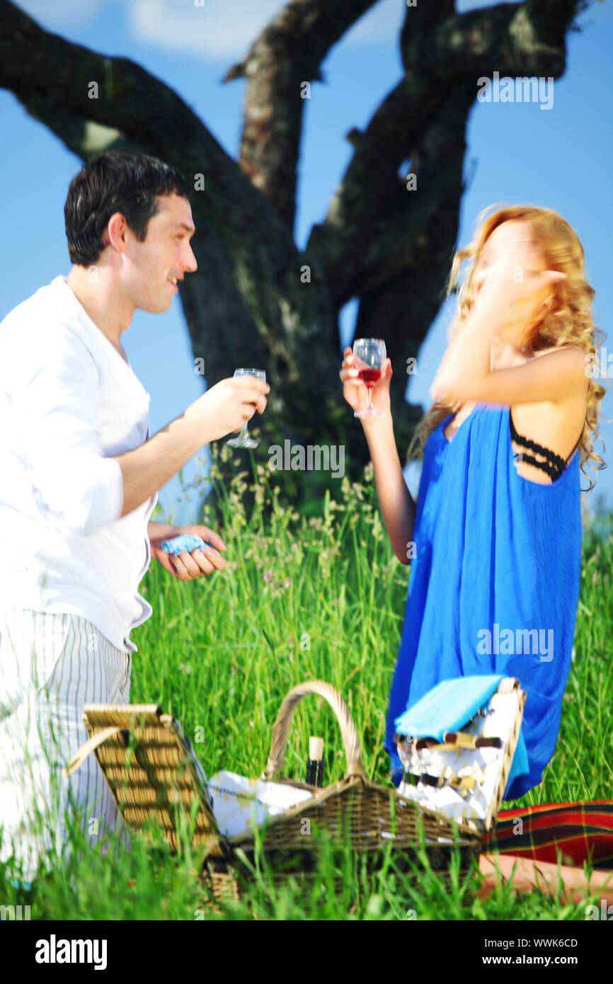 man and woman on picnic in green grass Stock Photo - Alamy