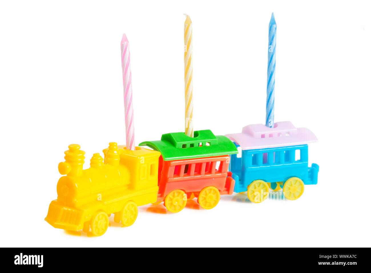 Three birthday candles in a train-shaped support Stock Photo