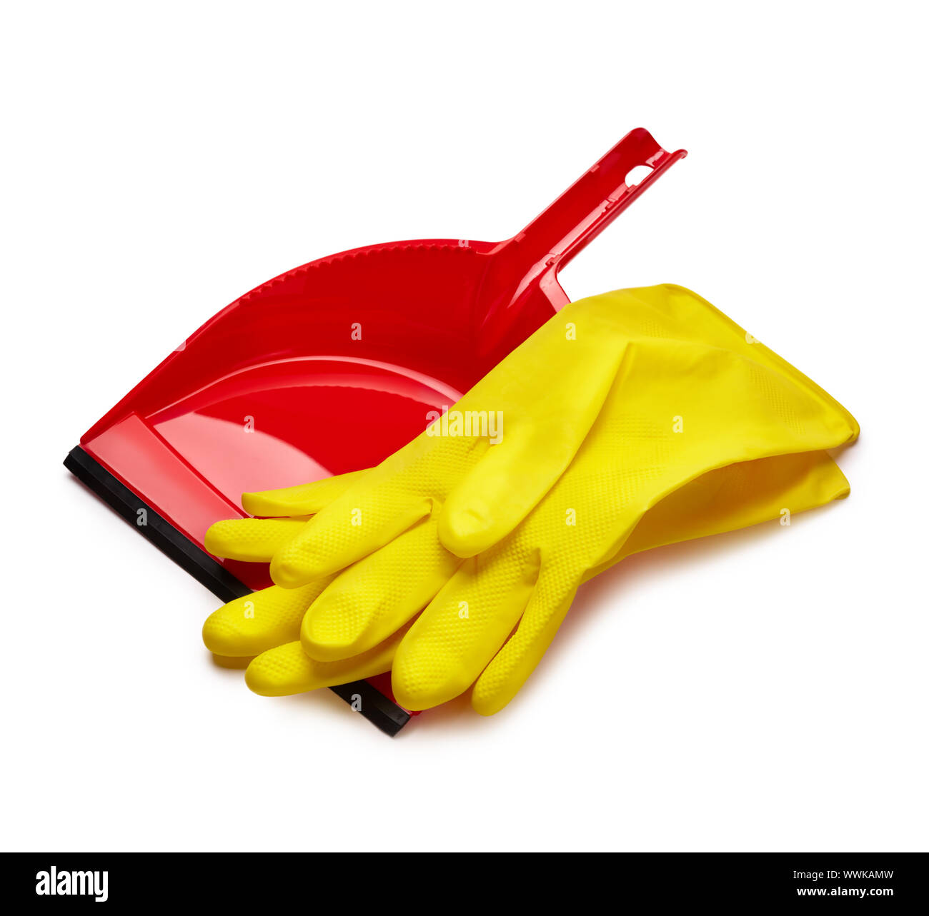 Rubber yellow gloves and red dustpan isolated on white background Stock