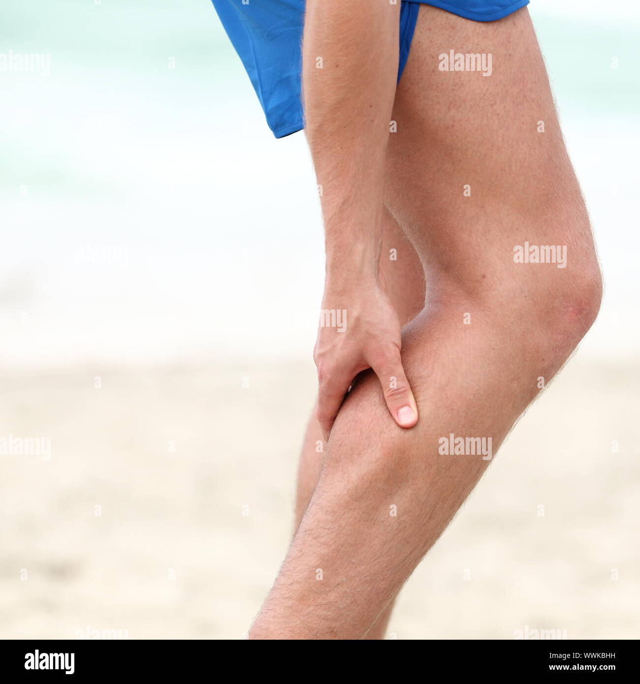 Leg calf sport muscle injury. Runner with muscle pain in leg Stock