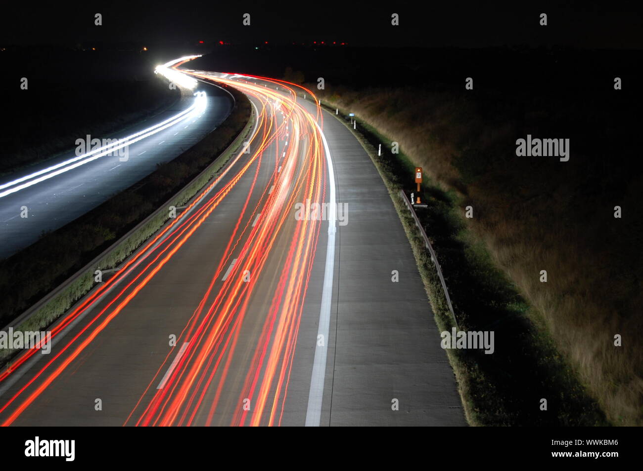 highway at night with car traffic and lights Stock Photo