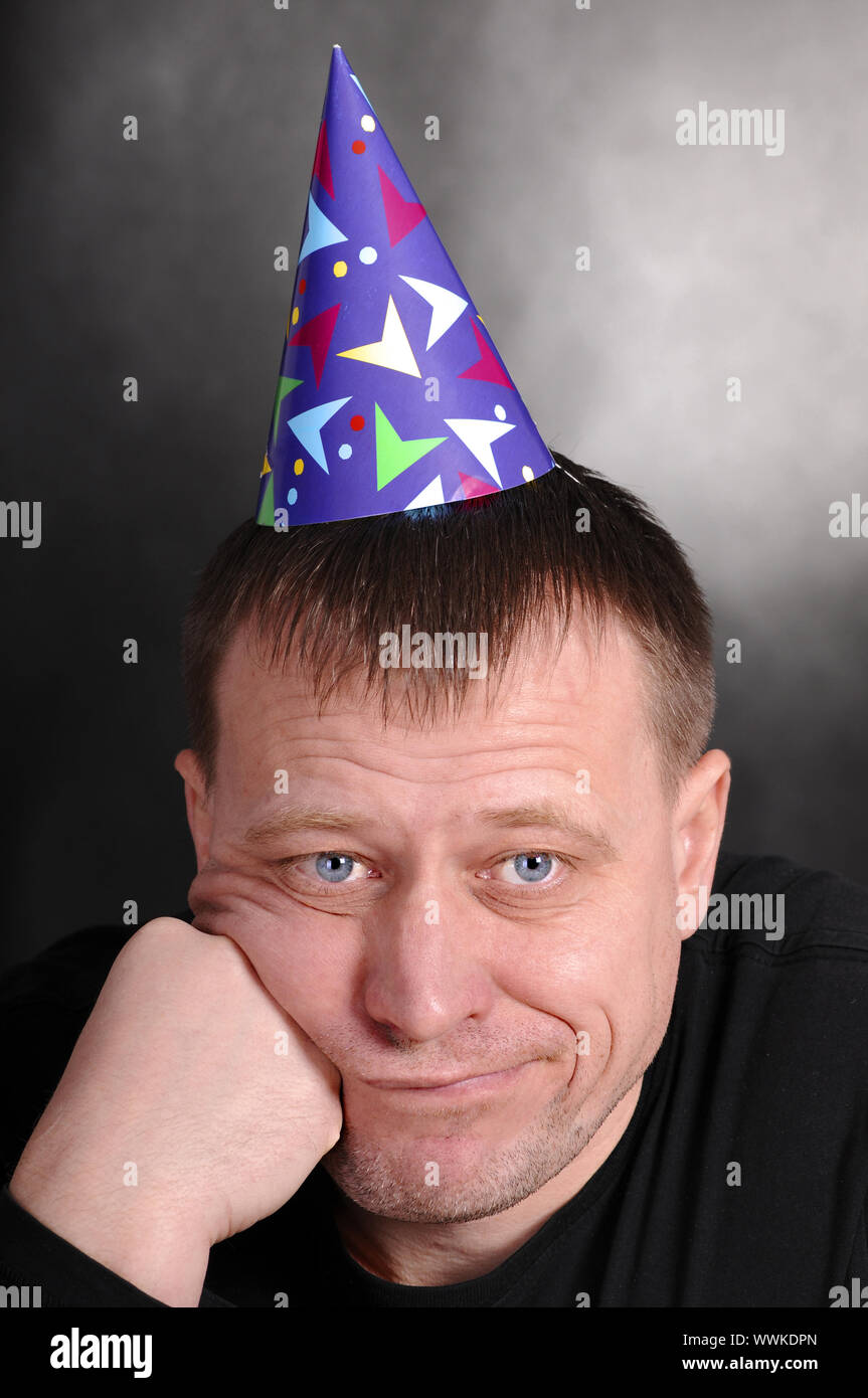 a sad man in the festive hood Stock Photo