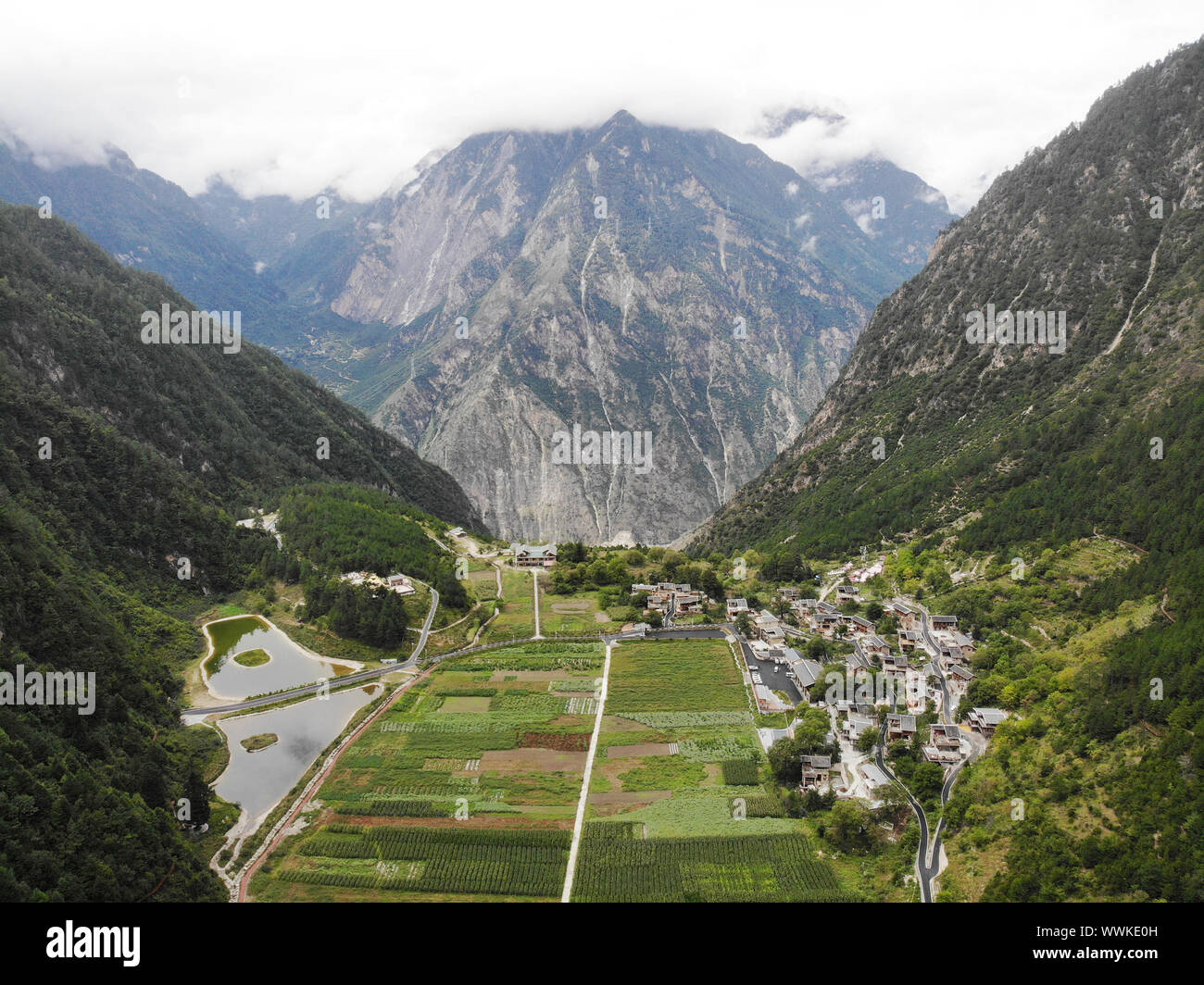 Chengdu. 9th Sep, 2019. Aerial photo taken on Sept. 9, 2019 shows general view of the Selong Village in Ganzi Tibetan Autonomous Prefecture of southwest China's Sichuan Province. An 875-meter-long tunnel changed the lives of 147 villagers once and for all in 2014, which was built as part of a relocation program for a hydropower station. TO GO WITH 'Across China: A mountain tunnel built for 147 people' Credit: Sun Ruibo/Xinhua/Alamy Live News Stock Photo