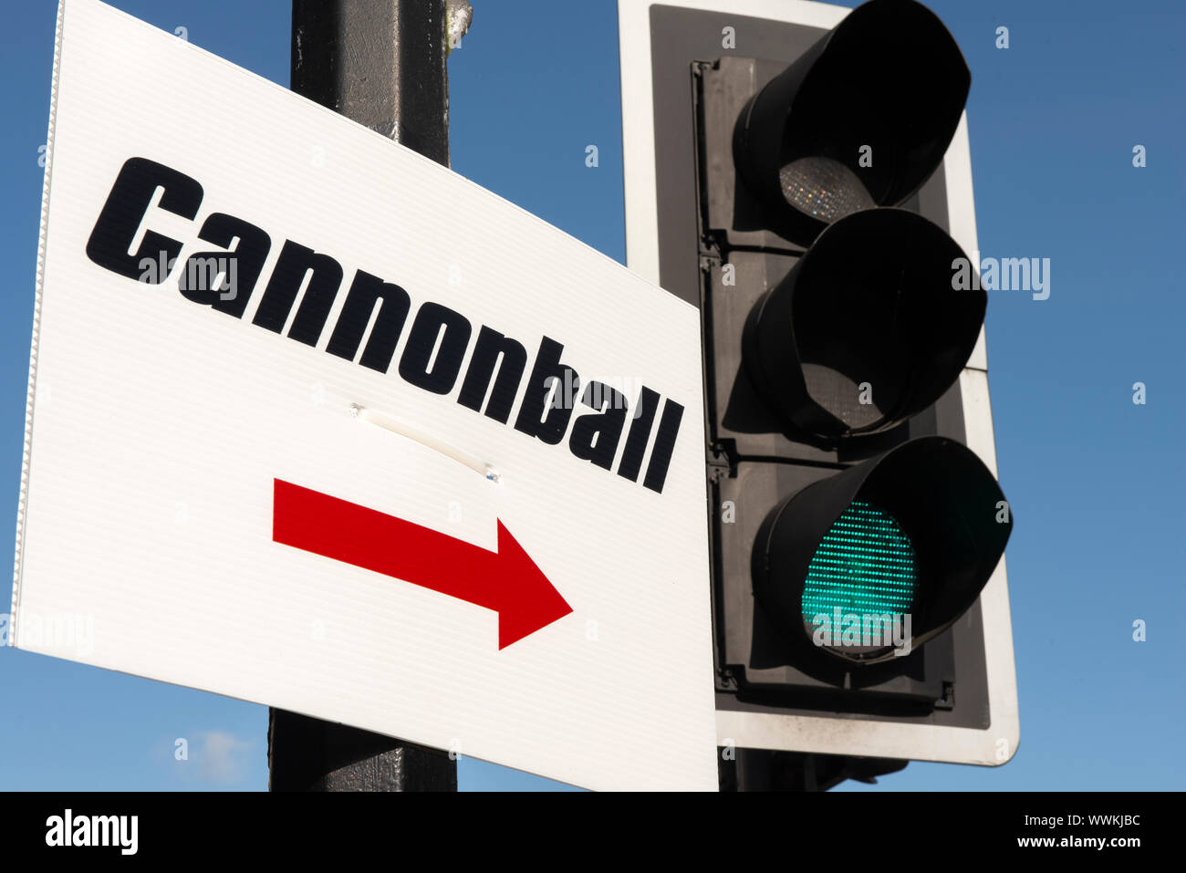 Cannonball run directional sign and traffic lights in Killarney, County Kerry, Ireland Stock Photo