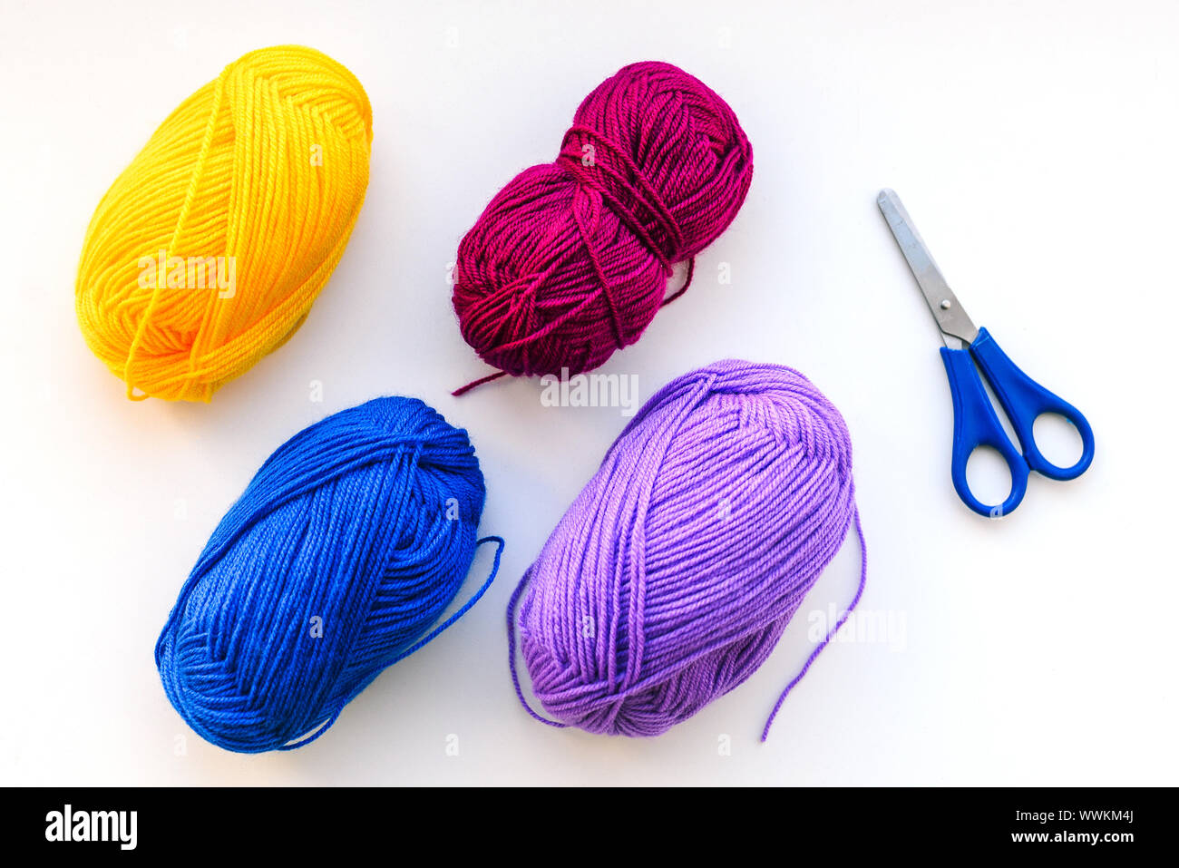 Knitting threads and scissors. Materials to do the work at home. Multi ...