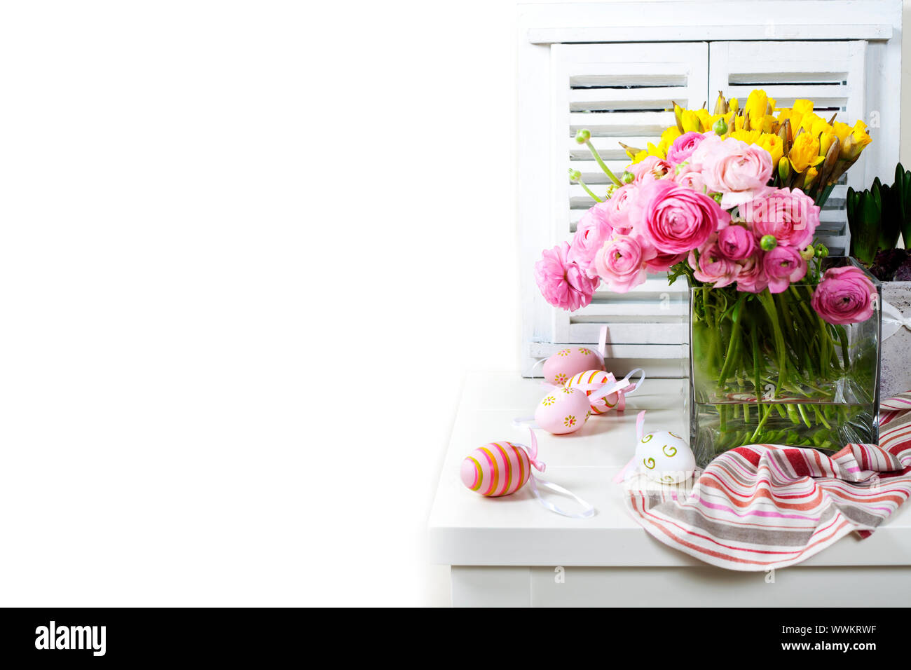 easter composition with eggs and spring flowers on white background ...