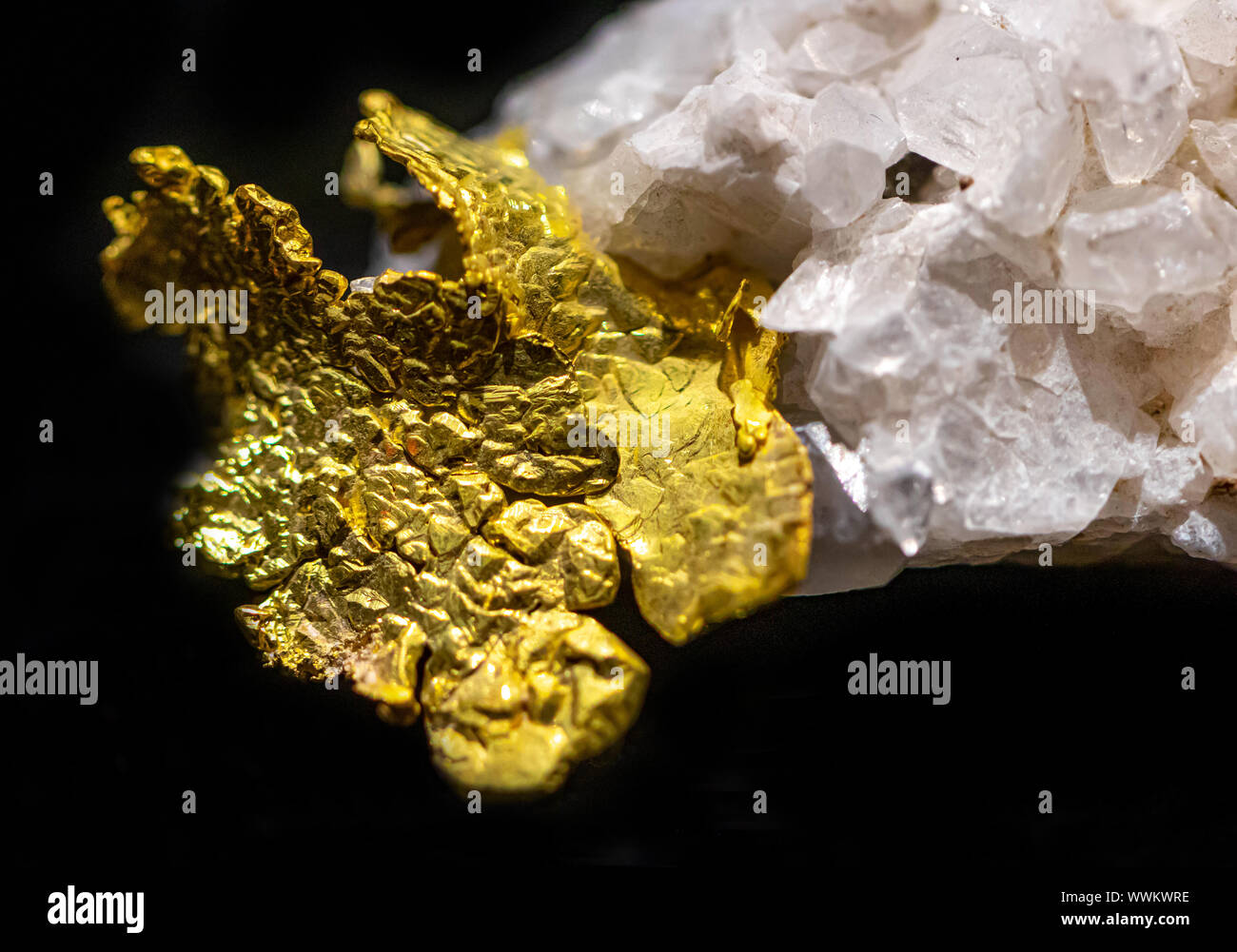 gold metal on quartz gem stone Stock Photo