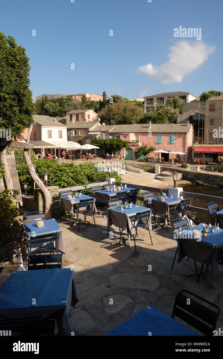 The cafes and restaurants of Port de Centuri  / Centuri fishing village and harbour in Haute-Corse of Cap Corse northern Corsica Stock Photo