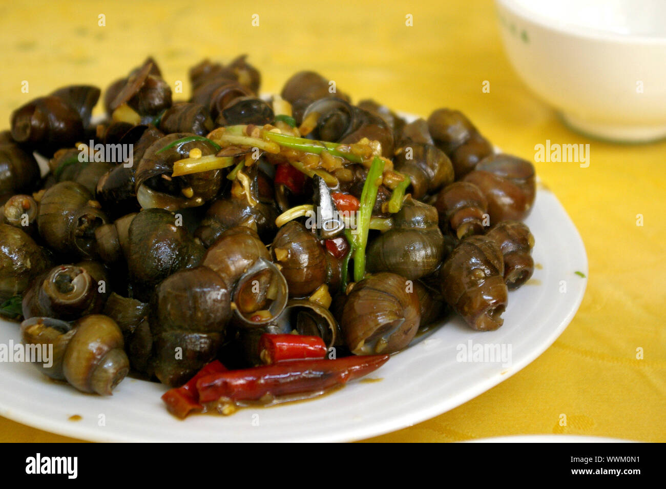 Spicy snails in Chinese style Stock Photo Alamy