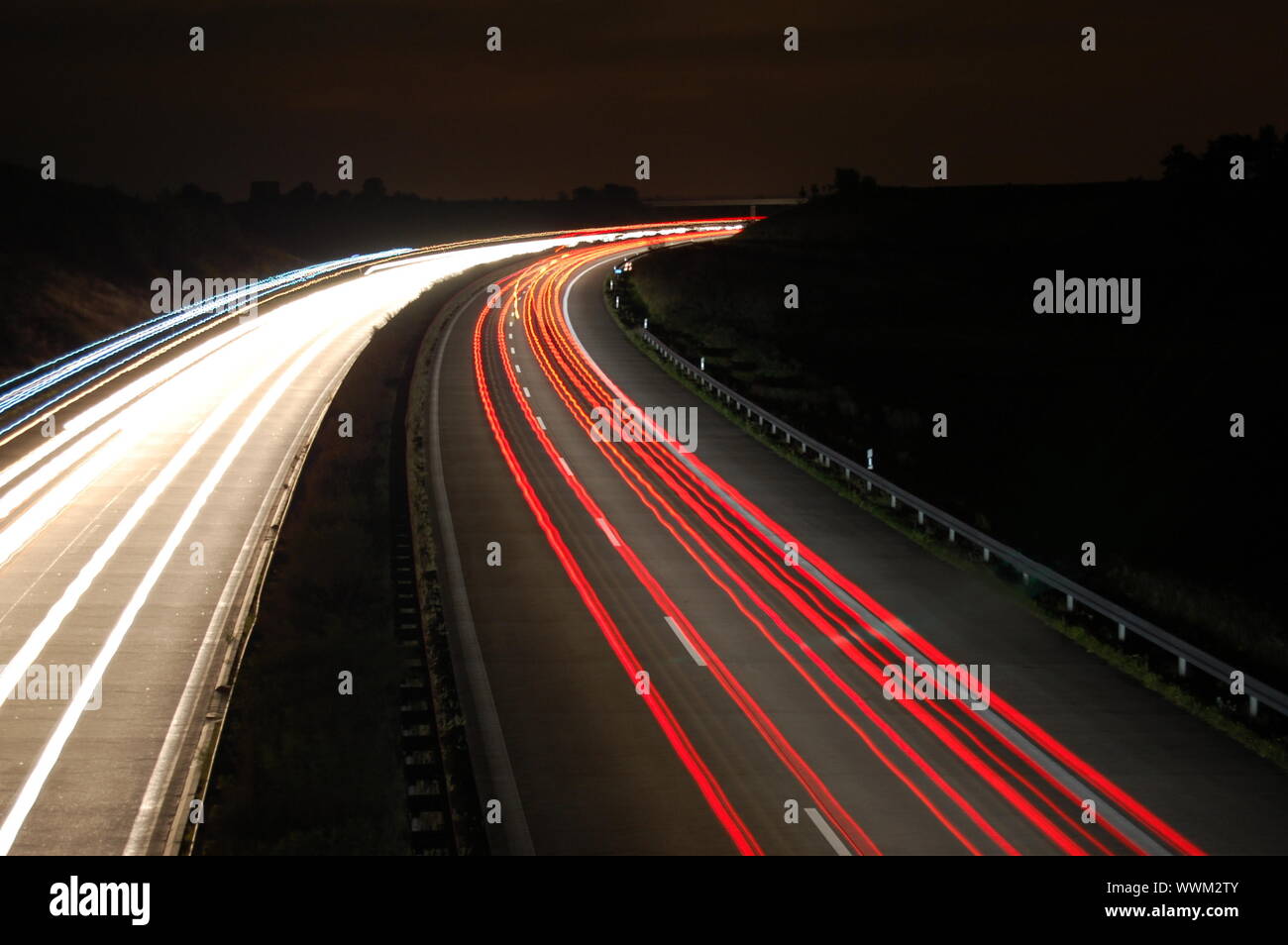 highway at night with car traffic and lights Stock Photo