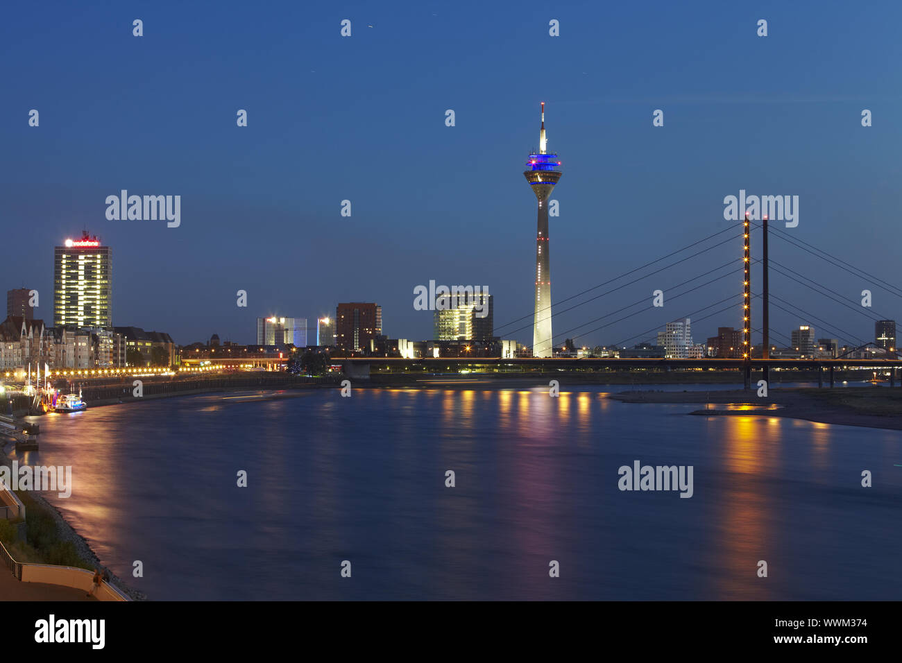 Düsseldorf - Rhine tower with bridge in the evening Stock Photo - Alamy