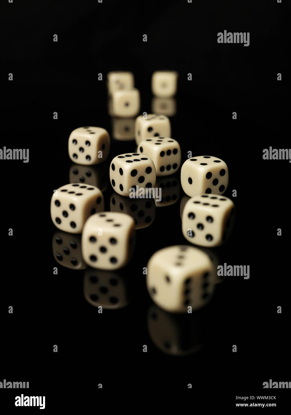Rolled dices on black background Stock Photo