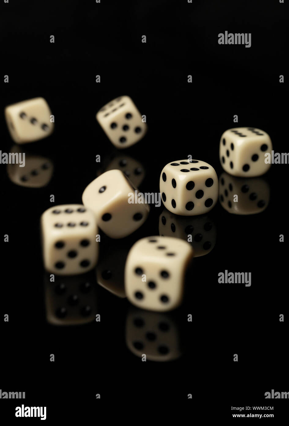 Rolled dices on black background Stock Photo