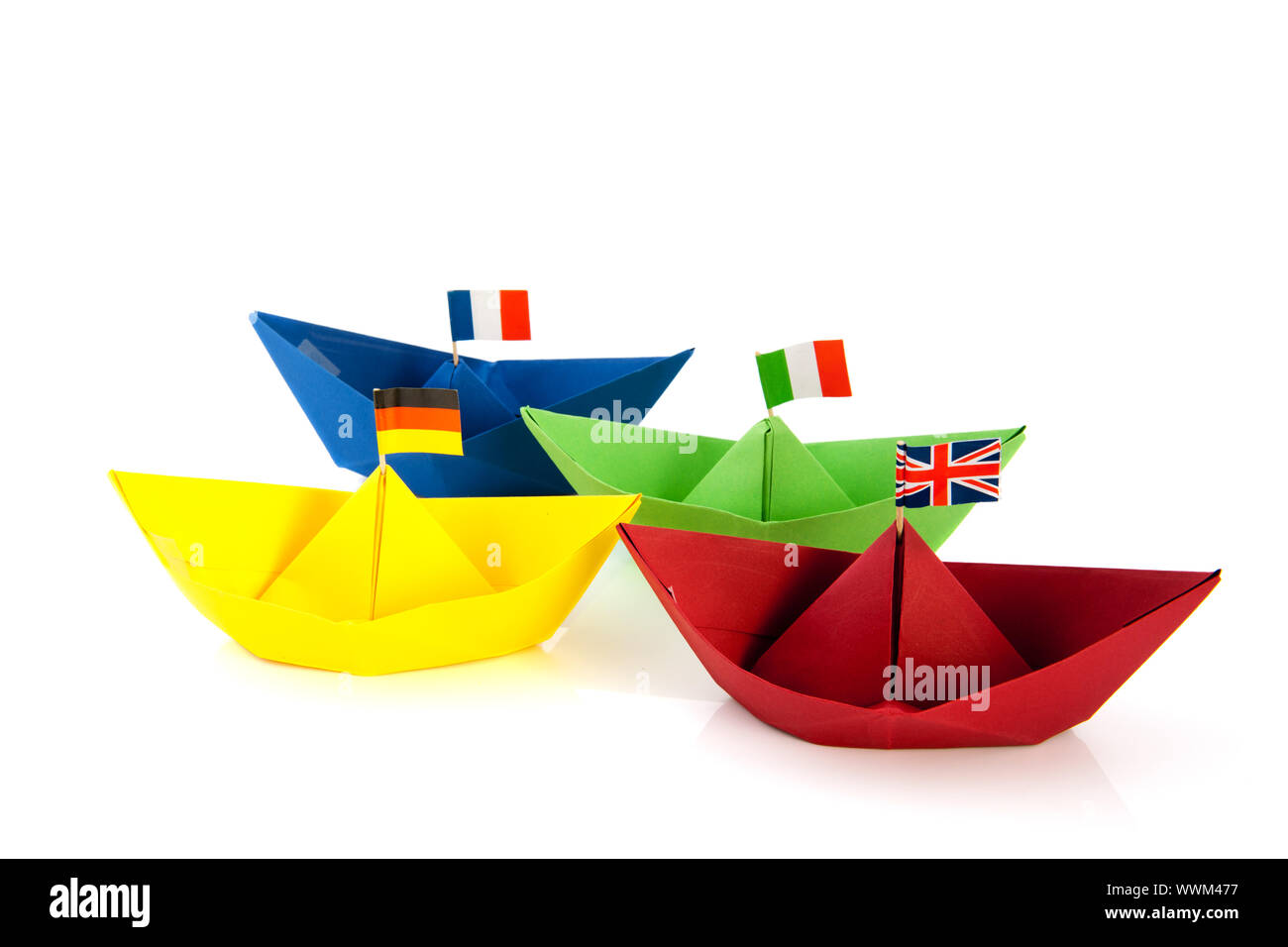 Colorful folded paper boats with European flags isolated over white