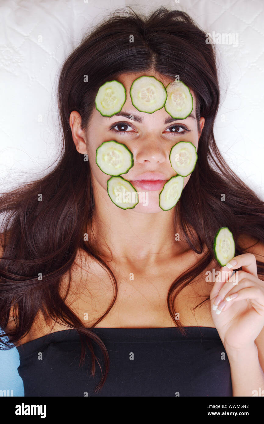 Girls relaxing cucumbers on eyes hires stock photography and images