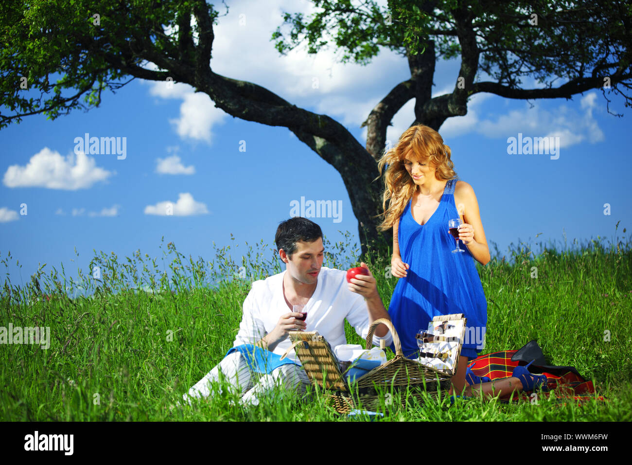 man and woman on picnic in green grass Stock Photo - Alamy