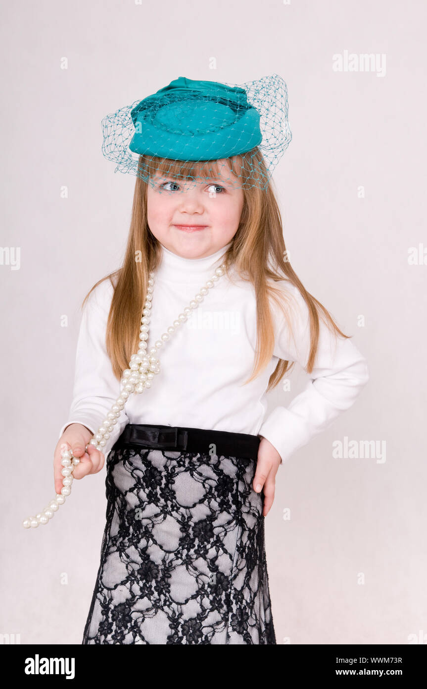 a little girl in the green hat Stock Photo Alamy