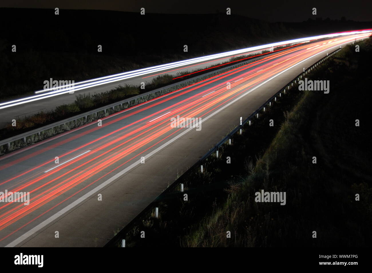 highway at night with car traffic and lights Stock Photo