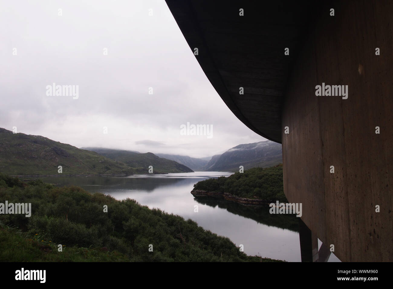 A view from underneath the Kylesku Bridge, Sutherland, Scotland, looking up Loch Gleann Dubh showing the curve of the bridge Stock Photo