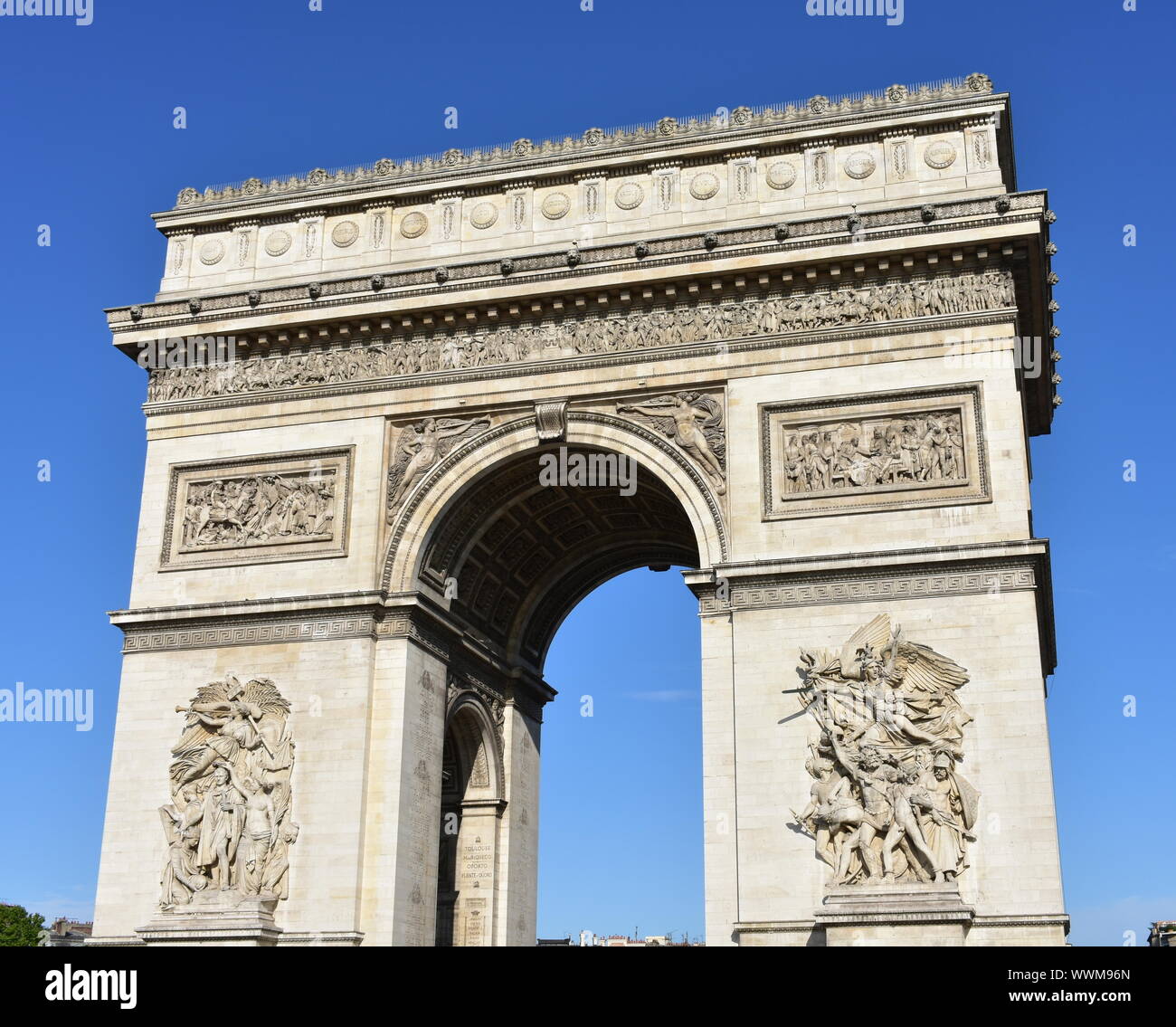 Arc de Triomphe from Champs Elysees with blue sky. Paris, France. Stock Photo