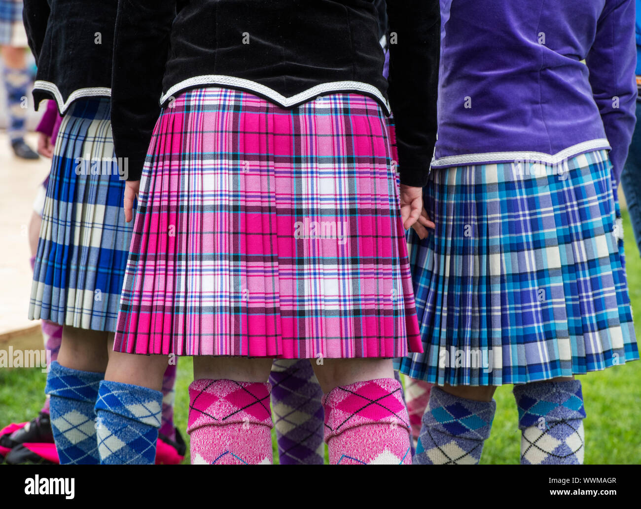 Young highland dancing girls wearing colourful tartan kilts at the Peebles highland games. Peebles, Scottish borders, Scotland Stock Photo