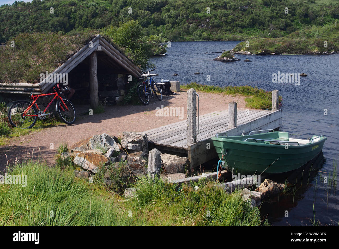 A view of a rowing boat moored at Loch Leitir Easaidh and a jetty ...