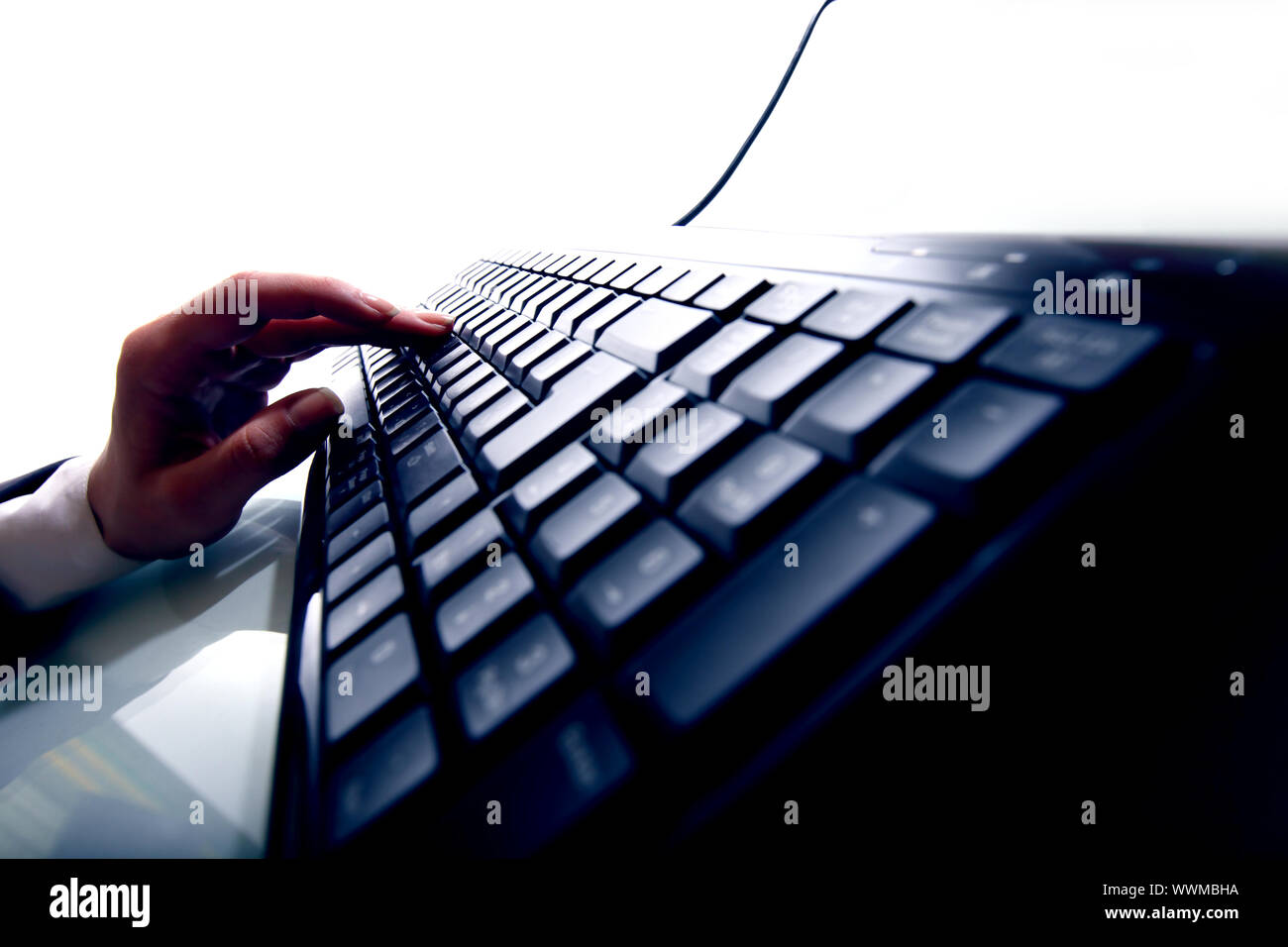 hand press a key on keyboard Stock Photo Alamy