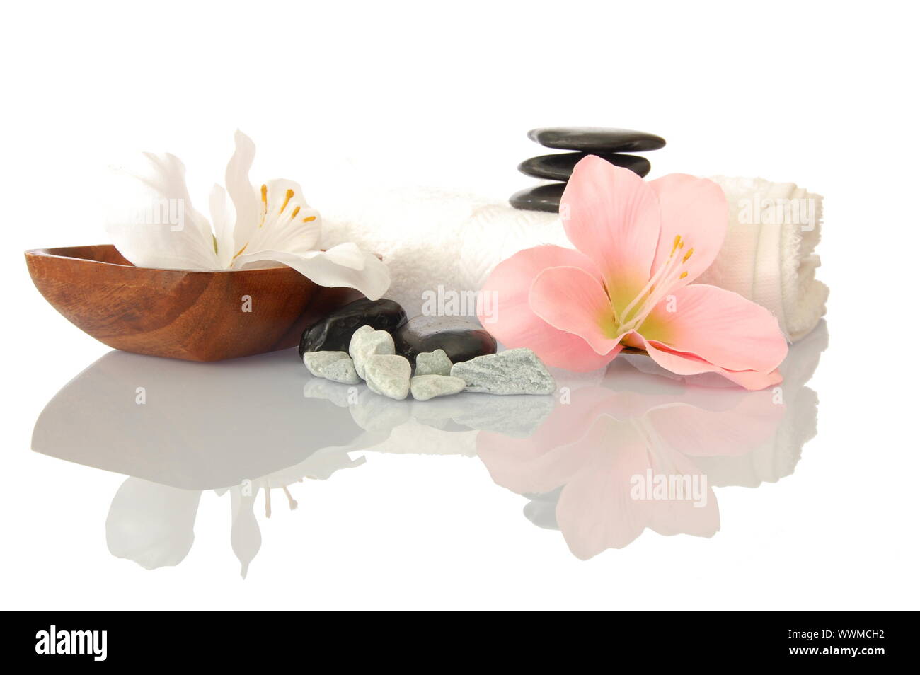 wellness zen and spa still life with flower towel and pebbles isolated on white Stock Photo